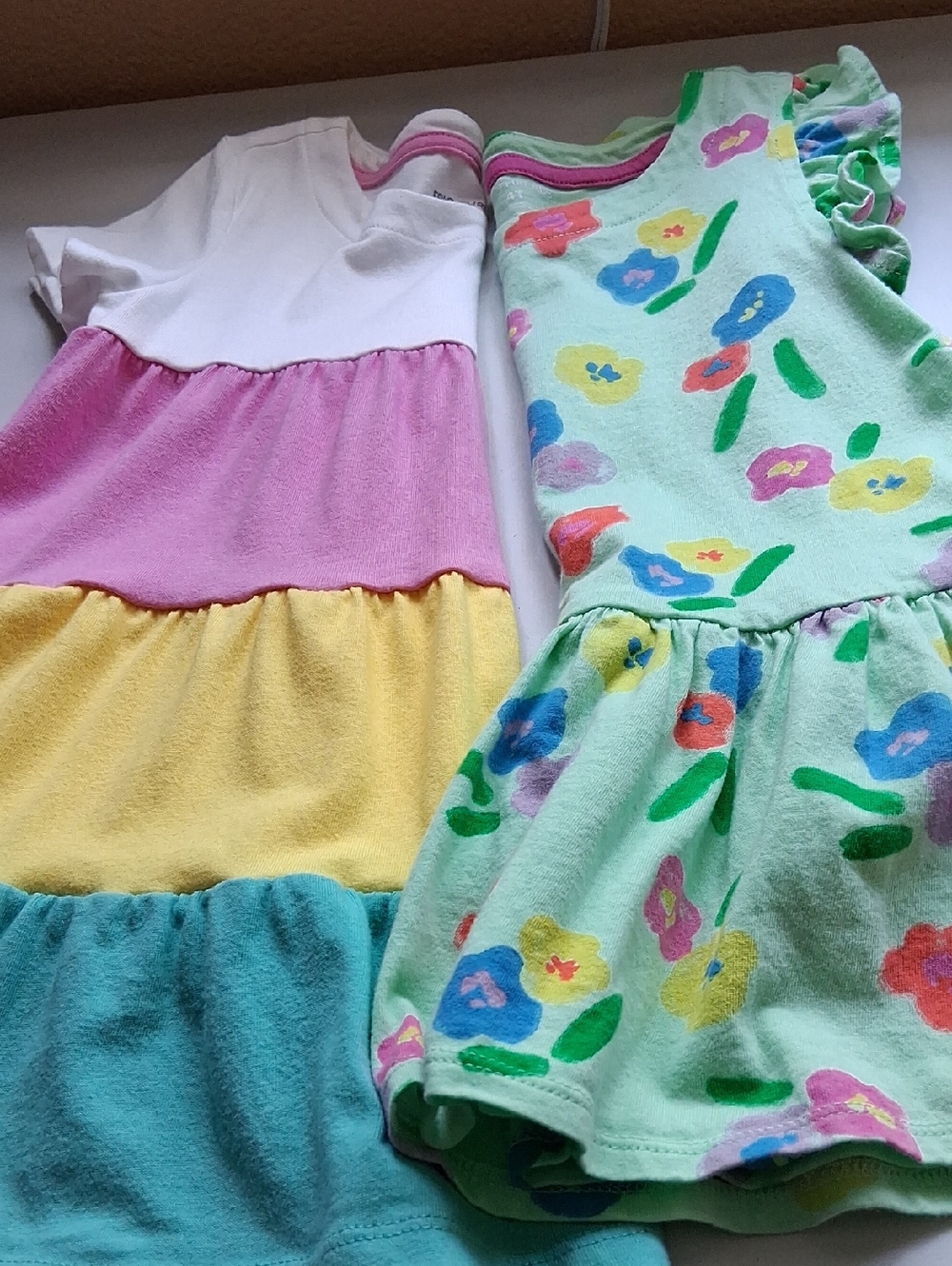 2 Charming Girls Dresses  Size 4T With Floral Accents And Colorblock Panels.